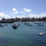 A group of boats docked in a body of water, perfect for a small business marketing workshop or mentoring session.