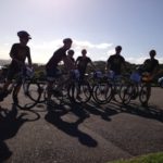 A group of people on bicycles posing for a picture during a small business marketing workshop.